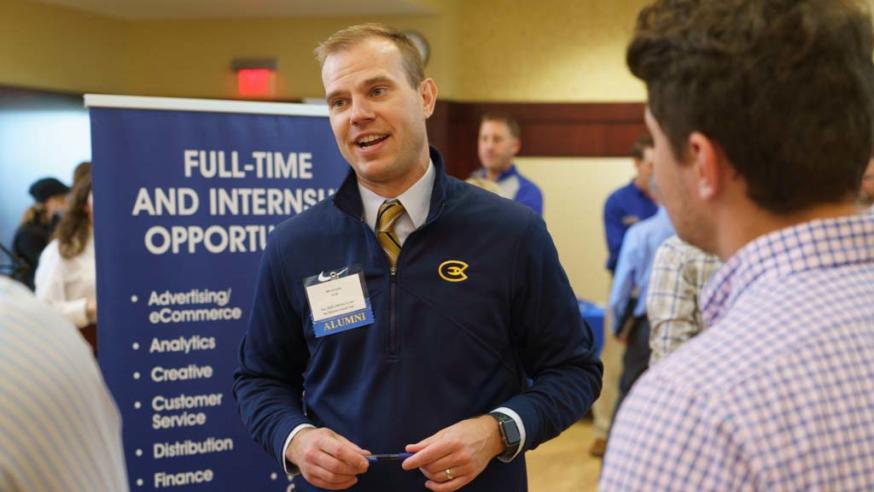 alumnus stalking to students at career event