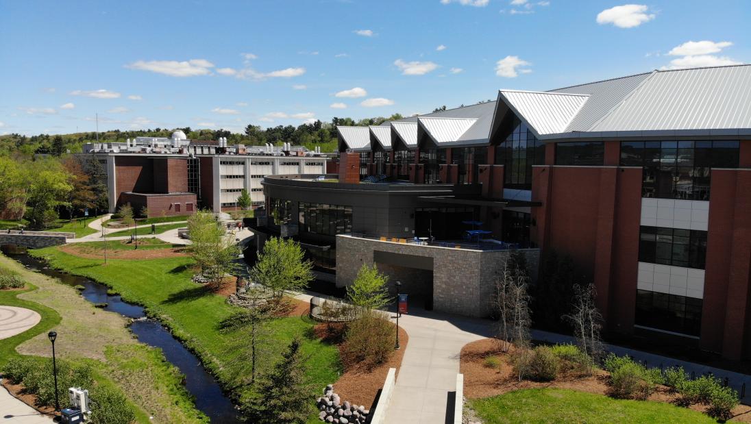 Aerial view of Davies Center and creek, no people 