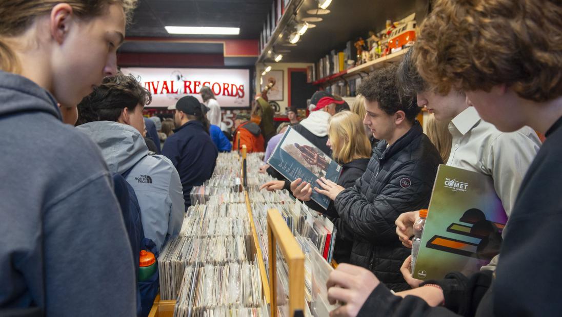 students looking at vinyl records in Revival Records