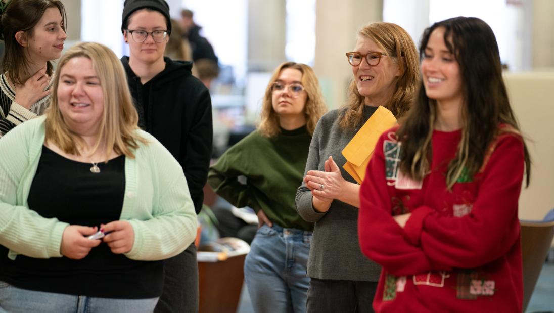 group of students watch presentation