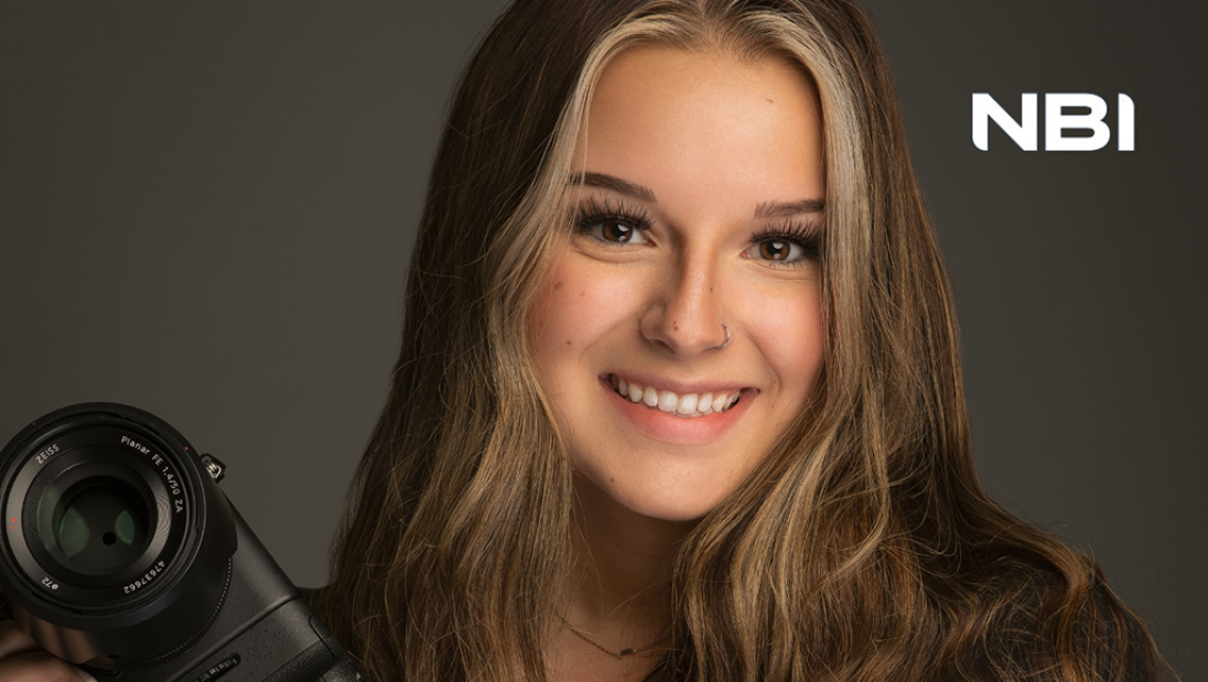 Professional photo of marketing student, Molly Curtis, at internship with National Business Institute