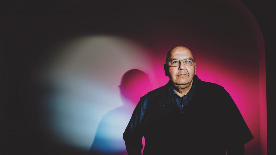 A man looks into the camera.