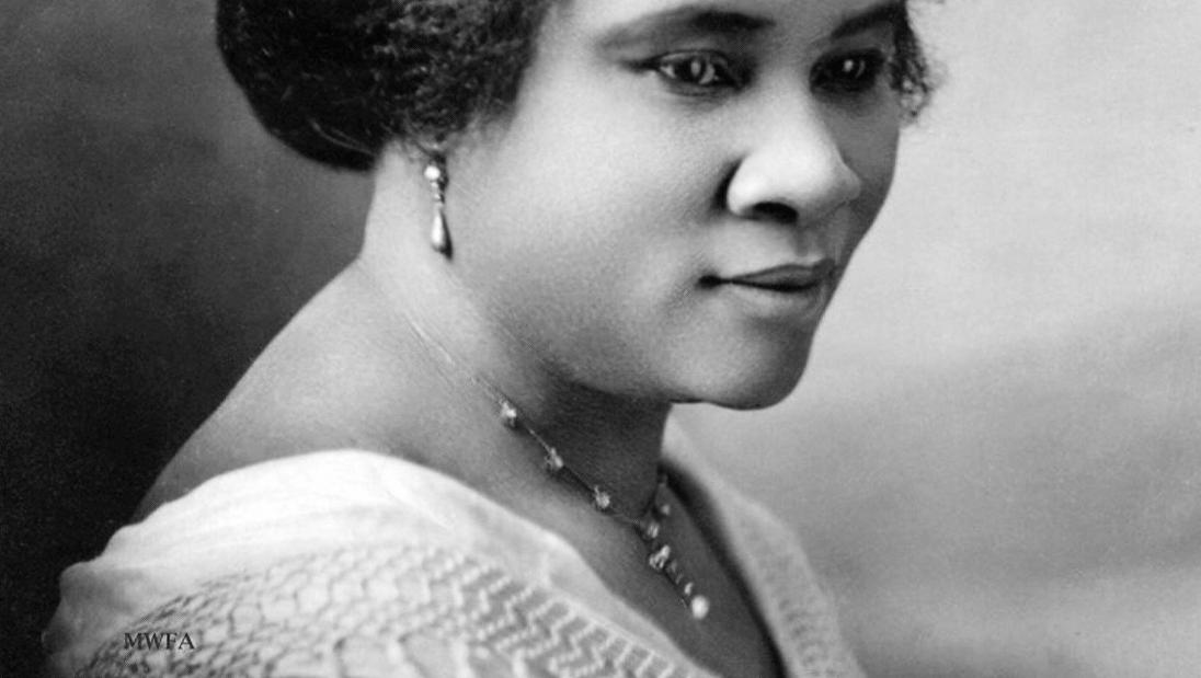 Vintage black and white portrait of a Black woman in profile.