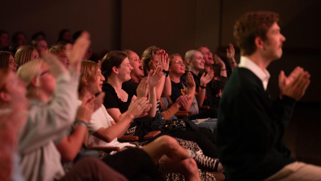crowd cheering in auditorium
