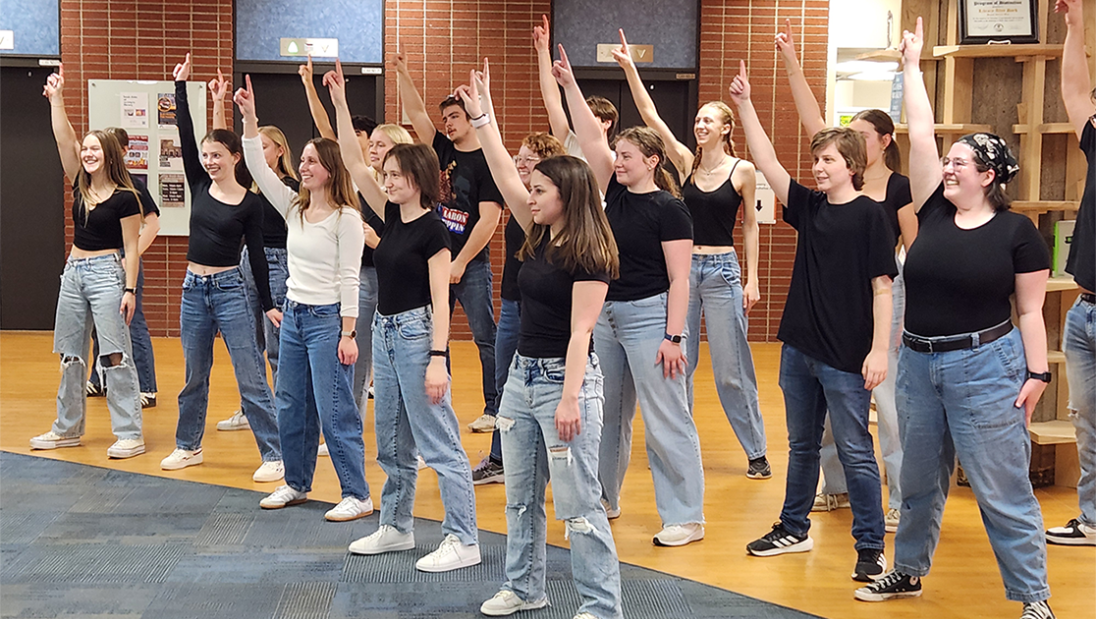 a group of students pose at the end of a dance