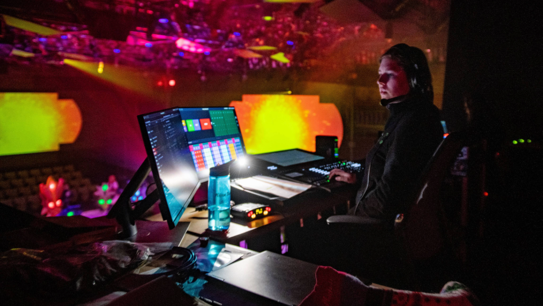 Lighting technician in the AV booth of JAMF Theatre Pablo Center