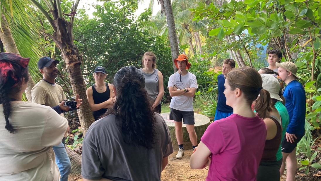 Students listening to a community member on a nature trail in Puerto Rico