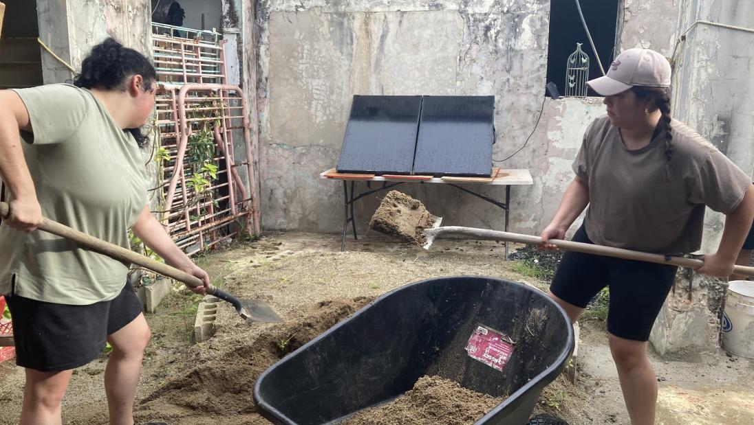 Students mixing concrete on a housing project in Puerto Rico
