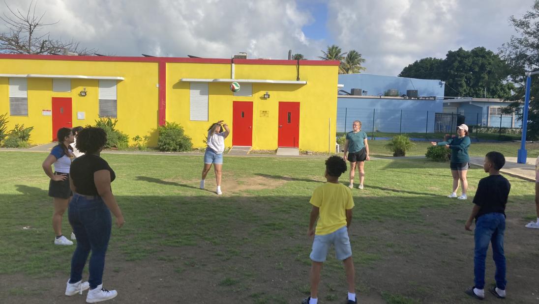 Puerto Rico immersion students playing volleyball at a local Boys and Girls Club