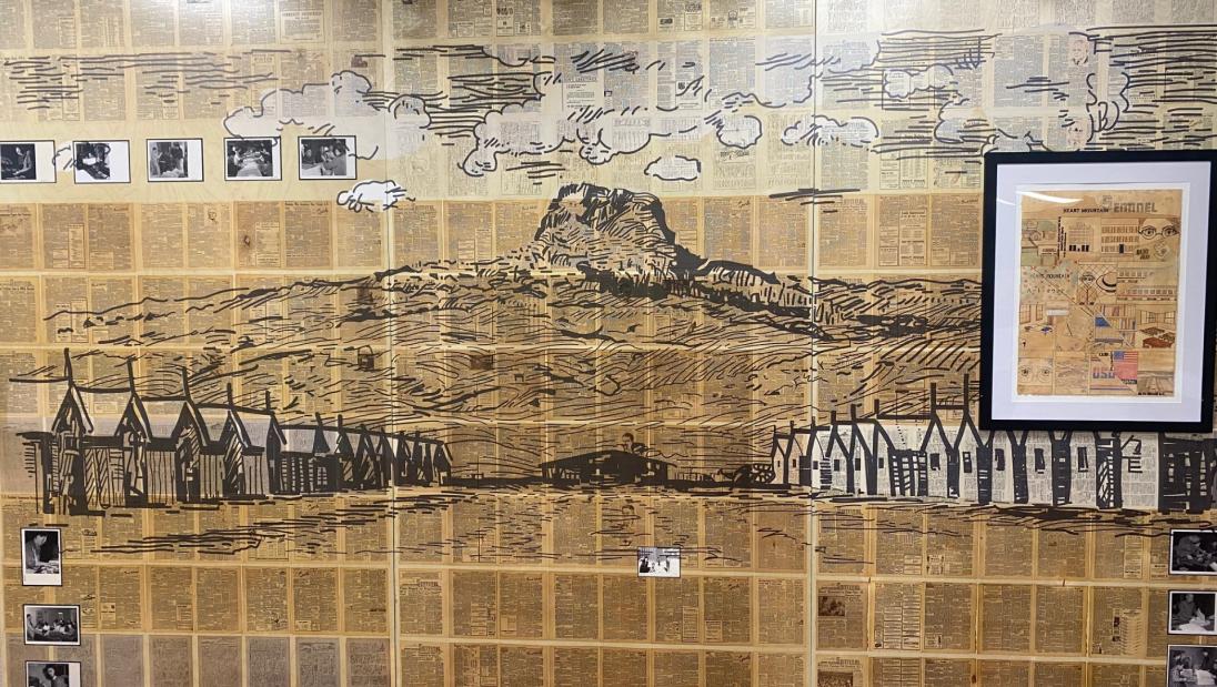 Professor Ellen Mahaffy's digital print on varnished birch plywood displays issues of The Heart Mountain Sentinel, War Relocation Authority photographs and student Abby Hable's manga about Claire Chase Dunn.