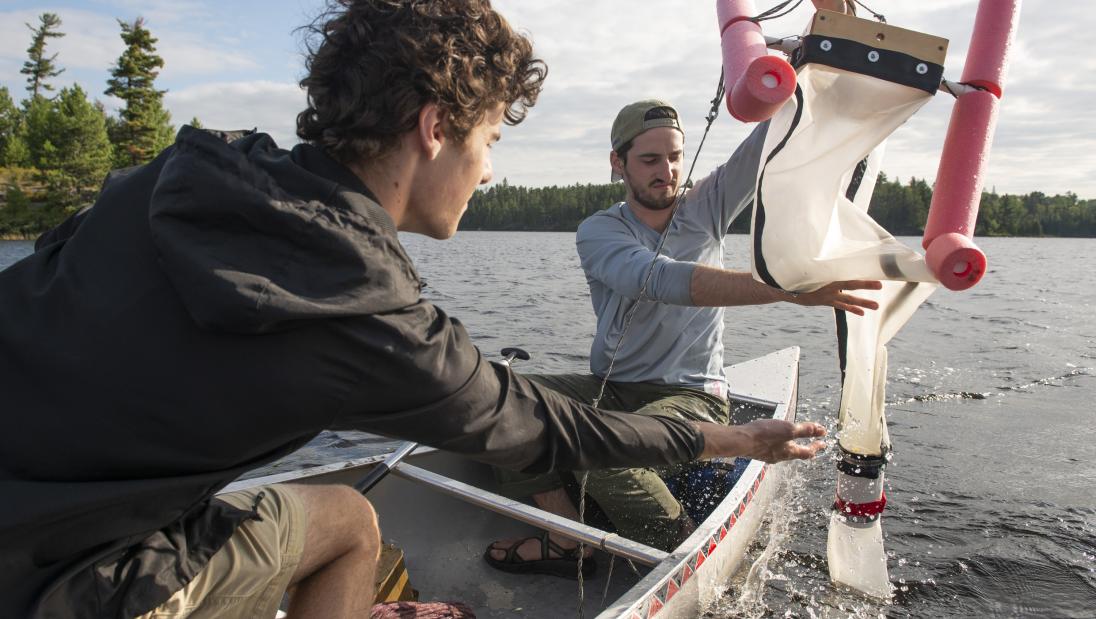 UW-Eau Claire students Reed Kostelny (left) and Thomas Adams are part of a research team that found microplastics in earthworms, water and soil in the Boundary Waters.