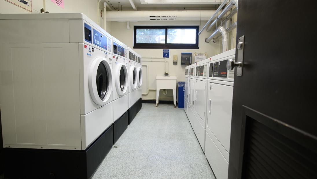 Laundry machines in a laundry room.
