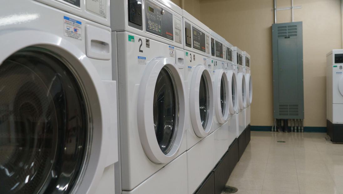 Washers and dryers in a laundry room.