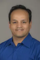 Professional portrait of Mohammad Aziz