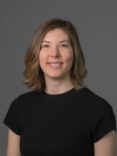 Picture of Katie Streckert, a young woman with shoulder length brown hair and light skin