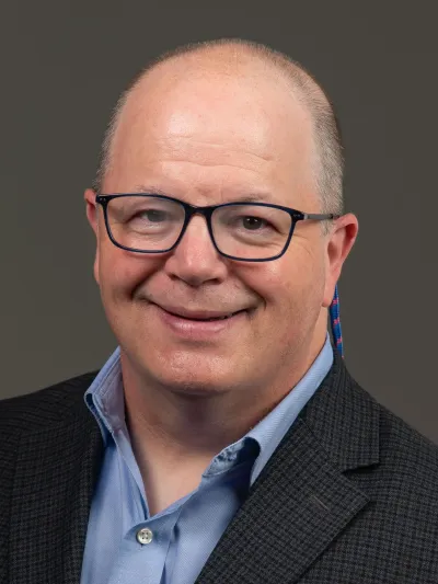 Smiling professor with glasses