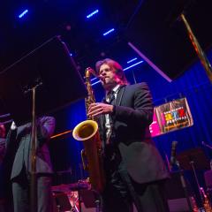 A band member plays the saxophone during Jazz Fest in downtown Eau Claire.