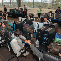 An image of UWEC esports gaming room filled with players.