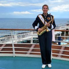 student on cruise ship in marching band uniform