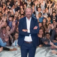 Richard Rossi on stage at the Future Docs Congress surrounded by students.