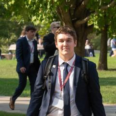 Student Walking and Carrying Sales Bags