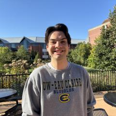 Dylan Baker smiles on UWEC's campus.