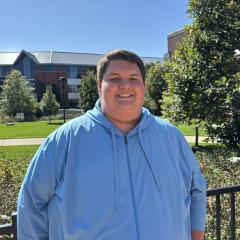 Zach Cardille smiles at the camera