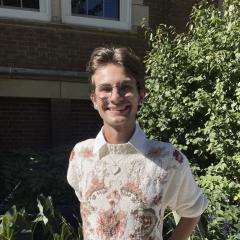 Calvin Lutzke smiles at the camera.