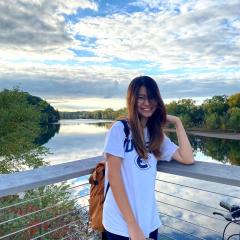Dorcas poses in front of the Chippewa River.