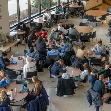 Full dining tables in Davies Student Center.