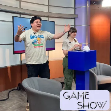 The hosts of Gameshow introducing the episode