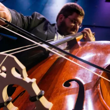 Double bass player performing in RCU Theatre