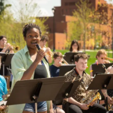 Jazz Ensemble with vocalist performing outside on the Chippewa Lounge