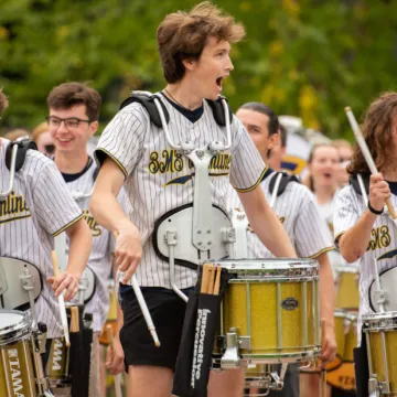 Blugold Marching Band drumline snare drummers performing outside Carson park