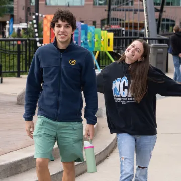 Two Blugolds smile at the camera during the annual UWEC Meets EC event.