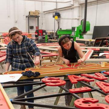 crew creating lighting display for Guys and Dolls show 