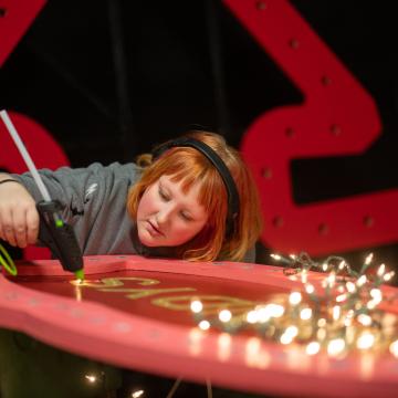 hot glue gun in use on set production 