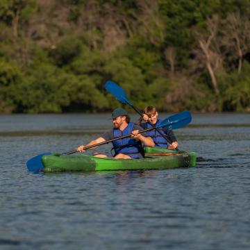 Two students kayak on the Chippewa River.
