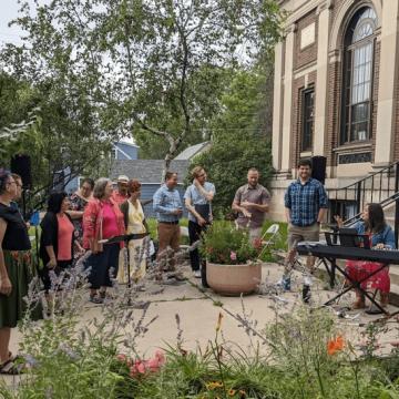 Choir singing outside a church building.