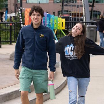 Two Blugolds smile at the camera during the annual UWEC Meets EC event.