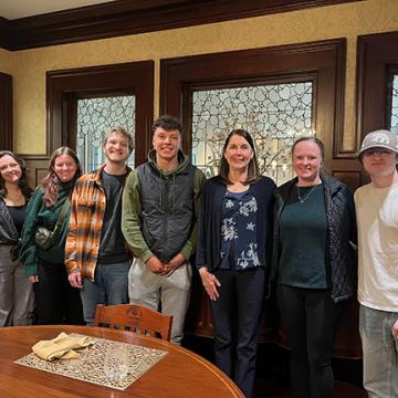 Students at welcome lunch with director