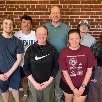 Students smiling in hallway