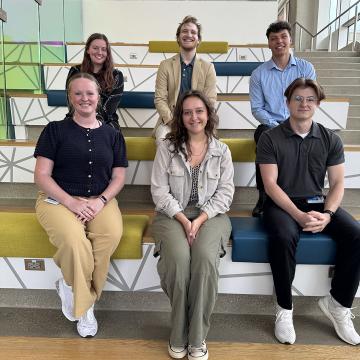 Students smiling at presentation