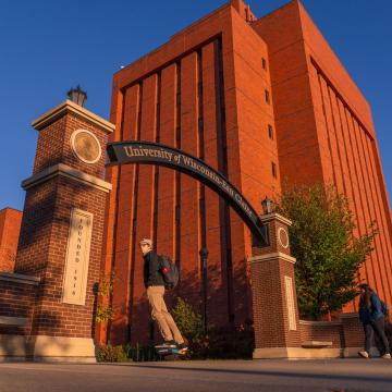archway morning light, fall, one wheel rider under the arch