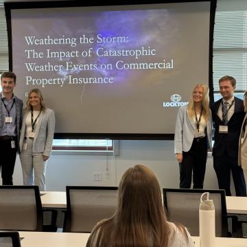 Hoffman and a group of Lockton interns pose for a photo