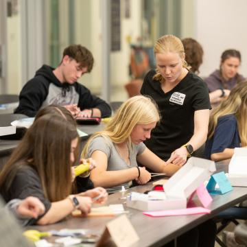 Students in Pre Professional tracks practice sutures in a lab with Mayo Clinic representatives.