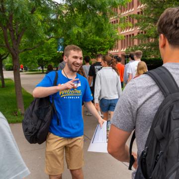 Students excitedly greet one another during Orientation.