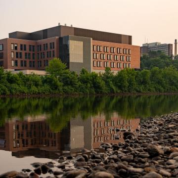 A view of the Riverside Science Ceter reflecting in the Chippewa River.