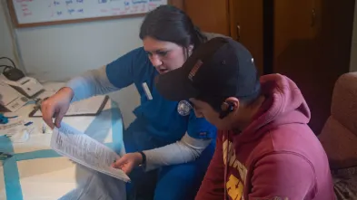 nursing student talking to migrant farm worker at clinical immersion 