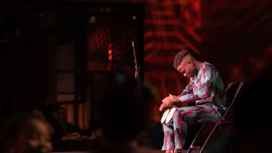 Olu Famule playing drums at celebration